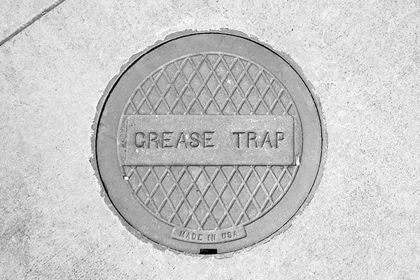 neglecting grease trap pumping can lead to clogged drains, sewage backups, and potential fines for non-compliance with regulations
